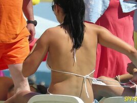 Girl sunbathe topless but voyeur films tits