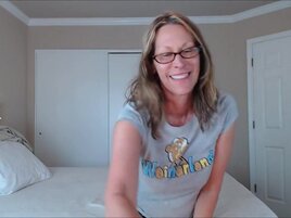 Momma with glasses drills her pussy with rubber dildo