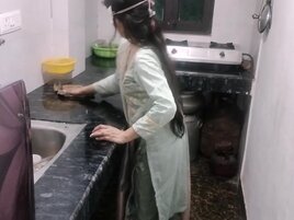 Masked Indian woman approached in the kitchen