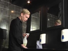 Inked blond fella deepthroats a twink in the bathroom