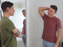 Tattooed lad with a cute face is giving a nice handjob